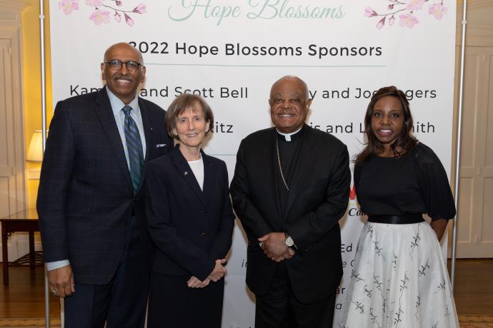 Photo of Emcee Michael Steele, CEO Sister Mary Bader, Wilton Cardinal Gregory, Board Chair Tonya Sharpe