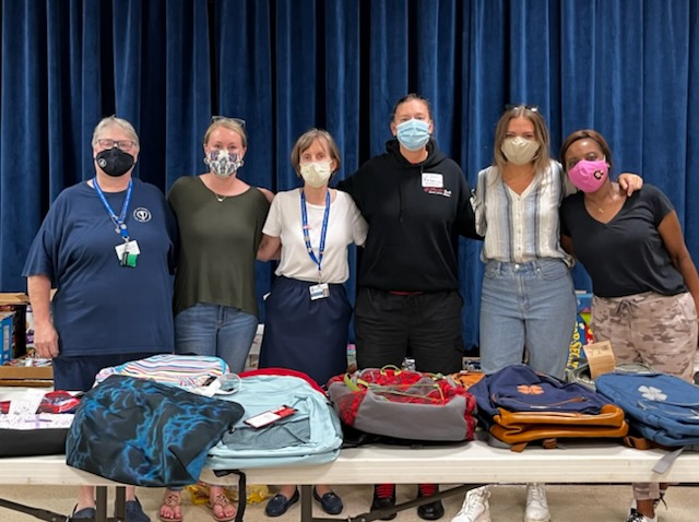 Sister Mary stands with volunteers from Jiffy Lube Live during a recent School Supply Drive at St. Ann's Center.